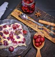 baked pie from cottage cheese and cherries on a glass plate