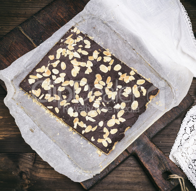 baked chocolate cake with almond chips