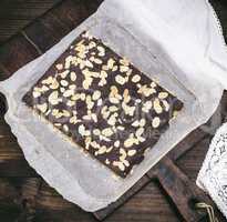 baked chocolate cake with almond chips