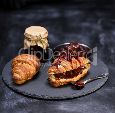 baked croissants with strawberry jam