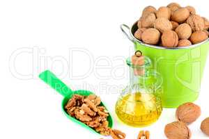 Oil of walnut and nut fruit isolated on white. Free space for te
