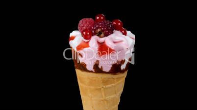 Forest fruits ice cream rotating on black background