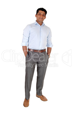 Relaxed East Indian man standing hands in pocket