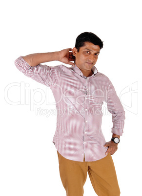 Man standing in brown pants and red checkered shirt