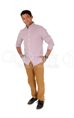 Man standing relaxed in red checkered shirt