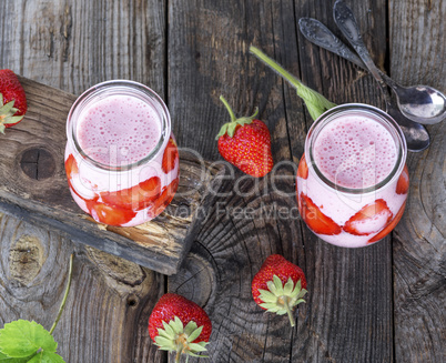 yoghurt with fresh strawberries in a glass jar