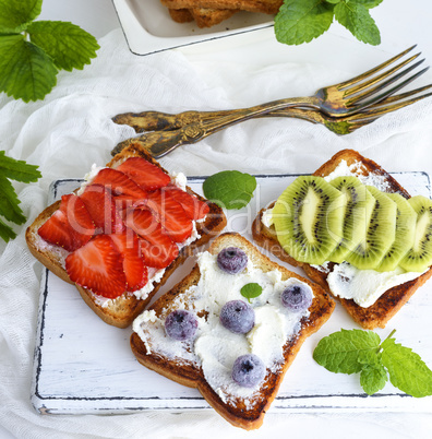 three French toasts with soft curd and fruit