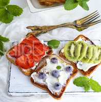 three French toasts with soft curd and fruit