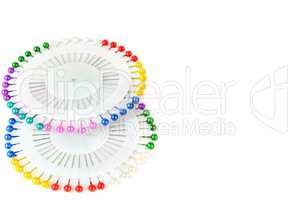 Lot of colorful pins isolated on a white background. Free space