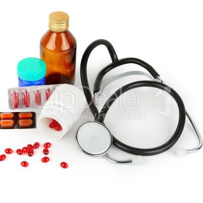 Stethoscope, pills and medical preparations isolated on white .