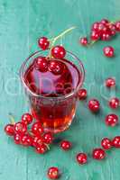 Redcurrant and glass of fruit drink juice