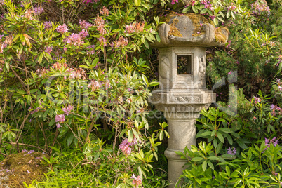 Japanese Pagoda Lantern Within Green Garden Setting
