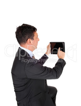 Business man looking at his tablet PS