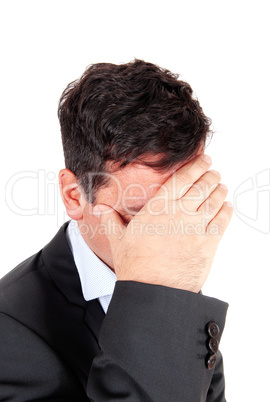 Business man covering is face he is depressed