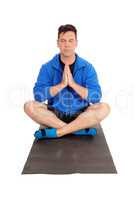 Handsome man sitting on floor doing yoga