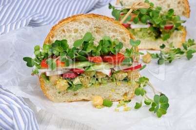 Sandwich with radish sprouts and vegetables