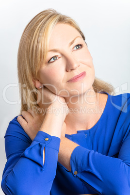 Studio Portrait of Healthy Thoughtful Middle Aged Woman