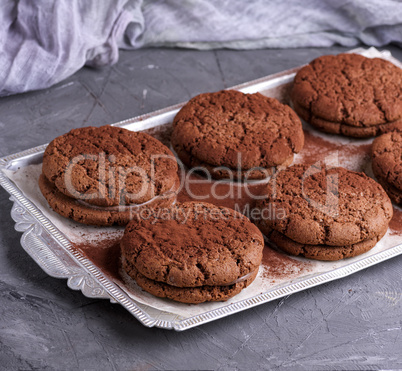 baked round chocolate chip cookies on a silver plate