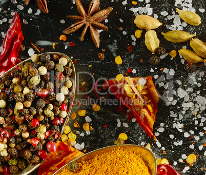 Variety of spices and herb on kitchen table.