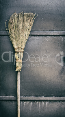 old broom on a wooden handle