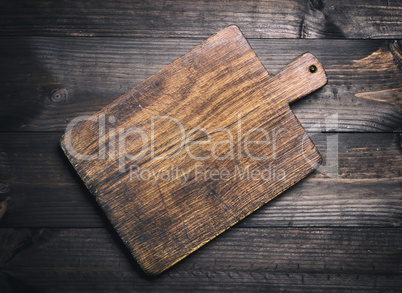 empty very old brown wooden kitchen cutting board