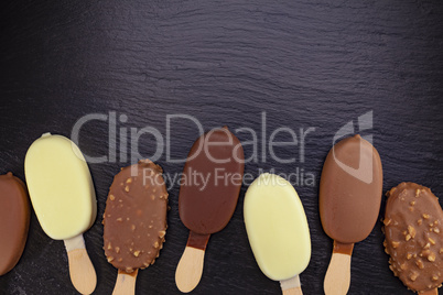 Ice cream on stick covered with chocolate