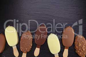 Ice cream on stick covered with chocolate
