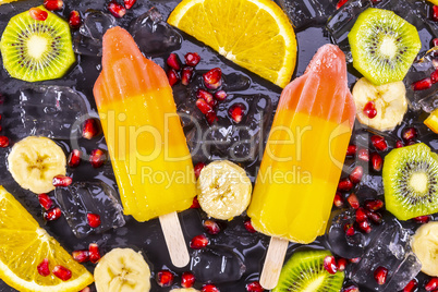 Fruit ice cream on stick with slices fruits