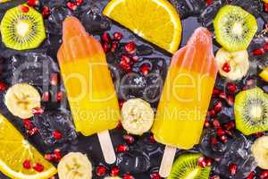 Fruit ice cream on stick with slices fruits