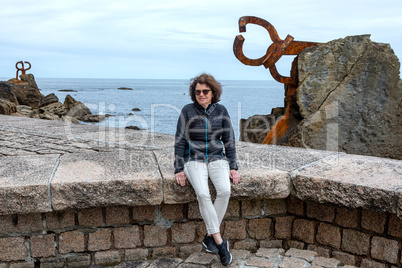 Woman enjoys vacation at the sea