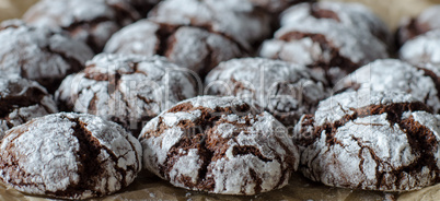 Chocolate crinkle cookies with powdered sugar icing. Cracked cho