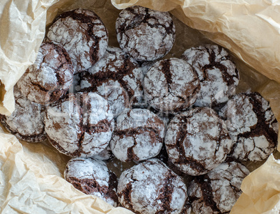 Chocolate crinkle cookies with powdered sugar icing. Cracked cho