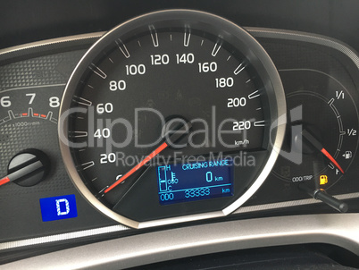 Close-up of car speedometer with information display - Low Fuel