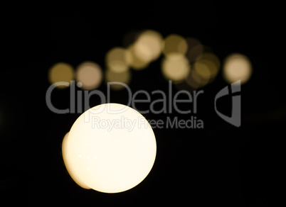 Soft bokeh background.  Garland of electric lights. Place to add