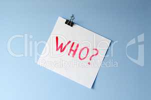 The word Who? on white paper sheet asking for help in solving a