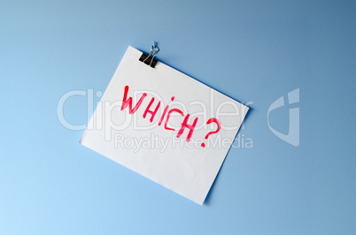 The word Which? painted on white paper sheet asking for help in