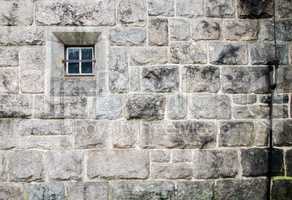 old church stone wall with small window texture background