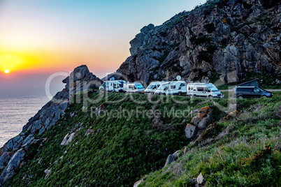 Mobile homes by the sea at sunset