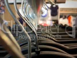 Many hangers on a clothes rack