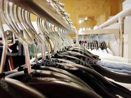 Many hangers on a clothes rack