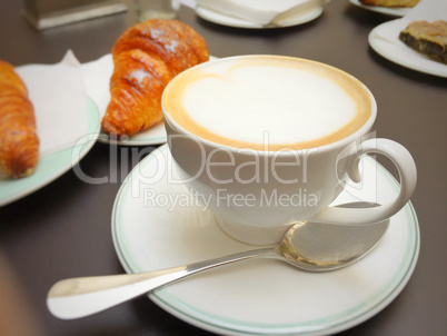 Morning breakfast with cappuccino and croissants