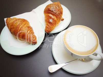 Morning breakfast with cappuccino and croissants