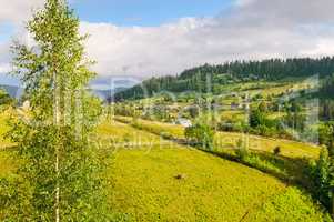 Slopes of mountains and clouds in the evening sky. Location plac