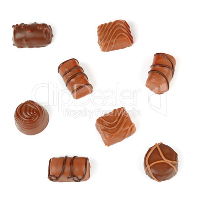 Assortment of chocolate candies isolated on white background.