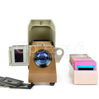 Old slide projector and set of slides isolated on white backgrou