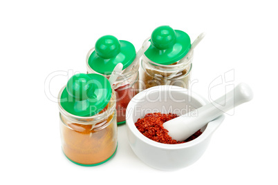 set of spices and mortar with a pestle isolated on white backgro