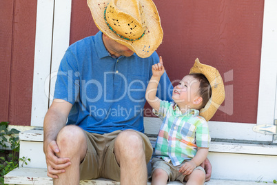 Playful Young Caucasian Father and Mixed Race Chinese Son Wearin