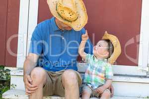 Playful Young Caucasian Father and Mixed Race Chinese Son Wearin