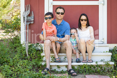 Portrait of Caucasian and Chinese Couple with Their Mixed Race Y