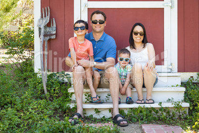 Portrait of Caucasian and Chinese Couple with Their Mixed Race Y